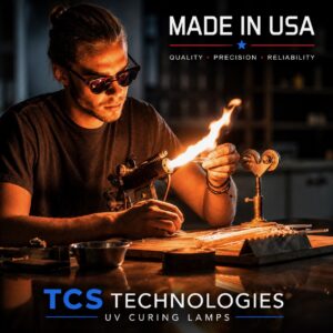 Skilled glassblower shaping high-purity quartz tubing with a hand torch during the precision manufacturing of a Made in USA TCS Technologies UV curing lamp.