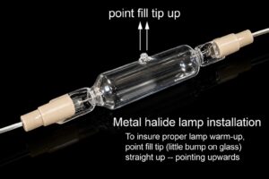Metal halide UV lamp showing fill tip positioned upward for proper installation.